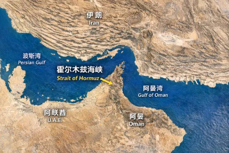 Aerial view of the Strait of Hormuz, a narrow maritime chokepoint between Iran and Oman, showing tanker traffic and the strategic coastline.