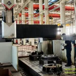 Machinist operating a heavy-duty gantry machining center for precision heavy casting components milling