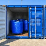 Railway wheels neatly arranged inside a shipping container ready for export