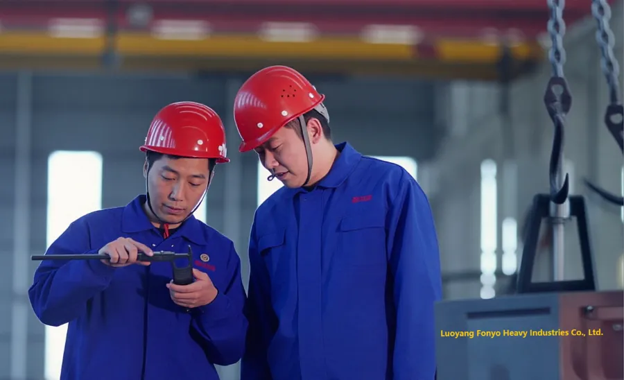 Two engineers measuring a metal part using vernier calipers in an industrial workshop.