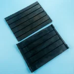 Rubber rail pad used in railway fastening systems for vibration damping and sleeper protection.