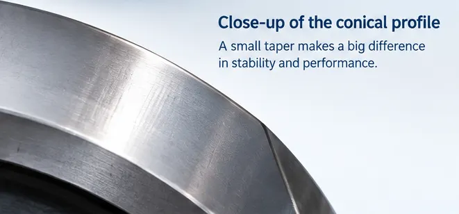 Close-up view of the tapered tread surface of a railway wheel