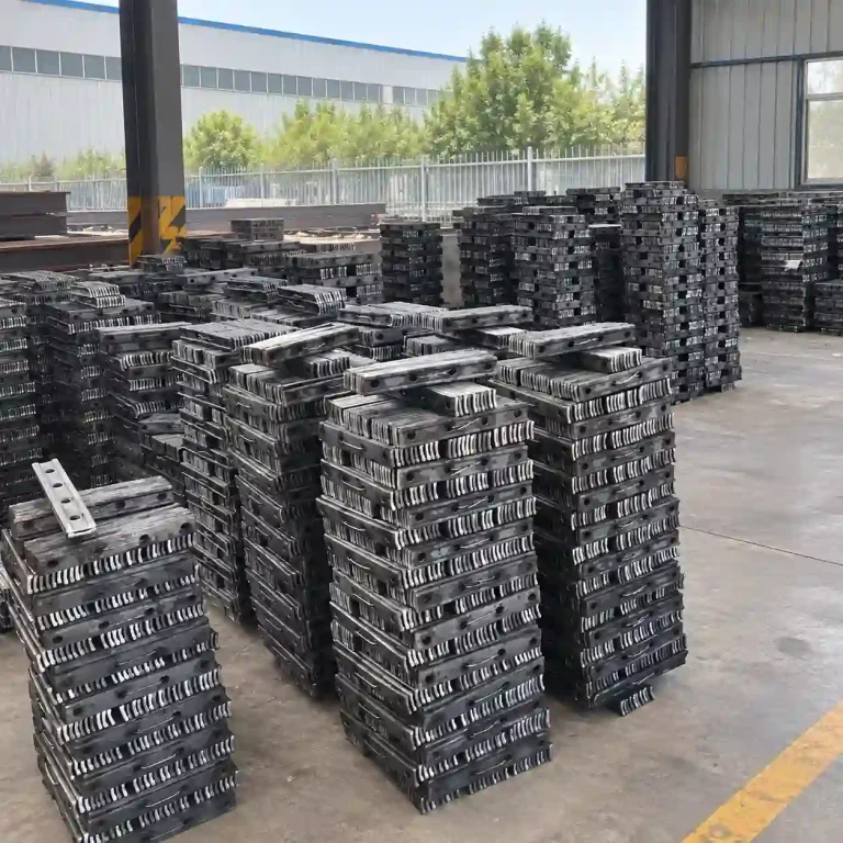 Rail fish plates stacked in a railway component factory