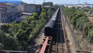 Rail Components for Mining Railways Alt text: Heavy-haul mining railway carrying loaded ore wagons on curved railway tracks.